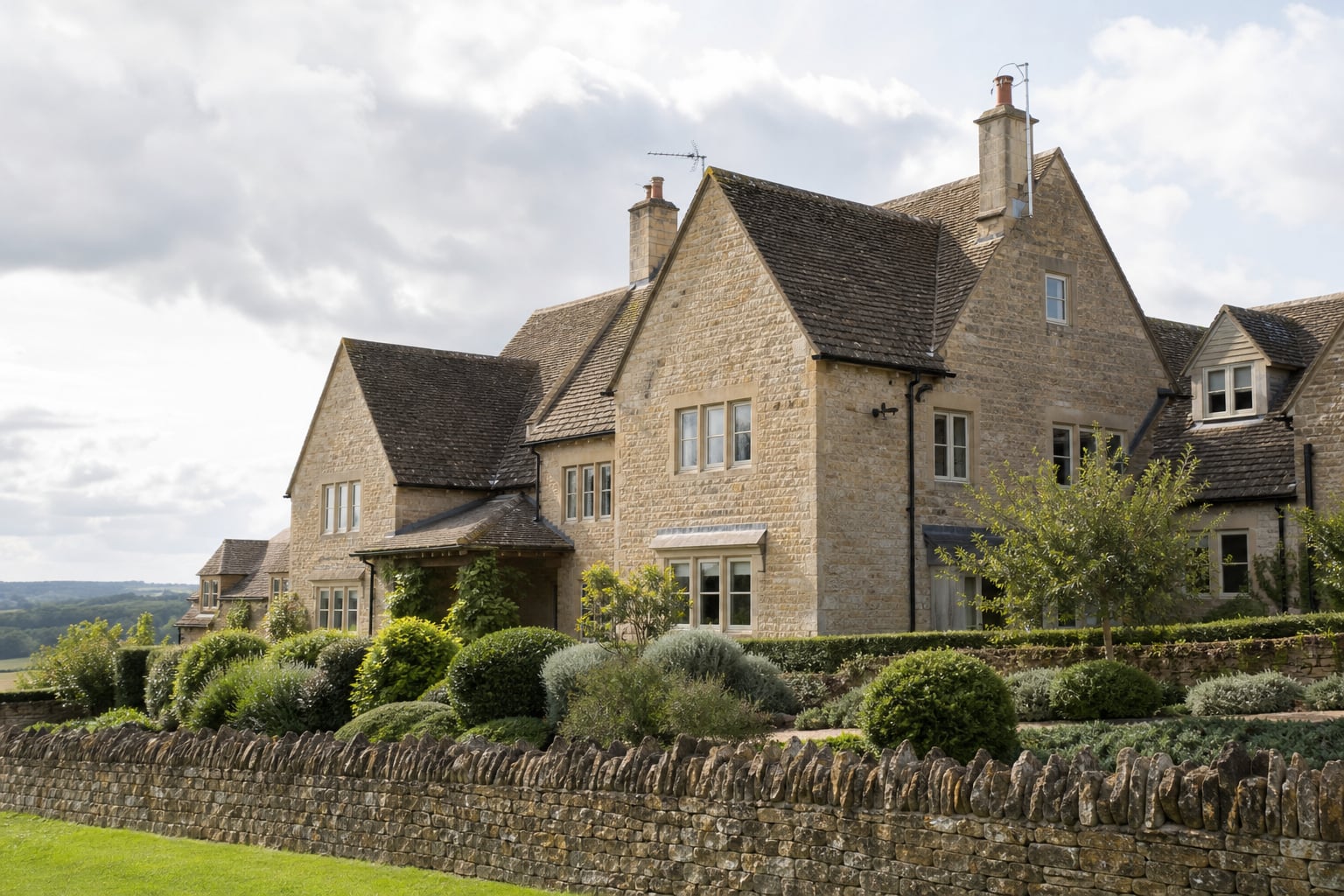 Honey-stone Stow holiday cottage exterior in soft light